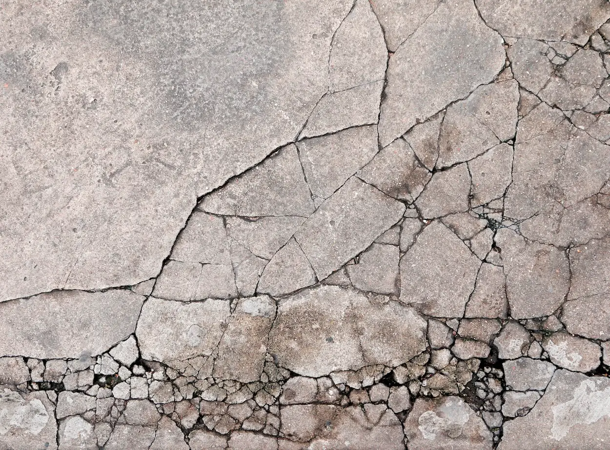 Cracked concrete texture closeup background
